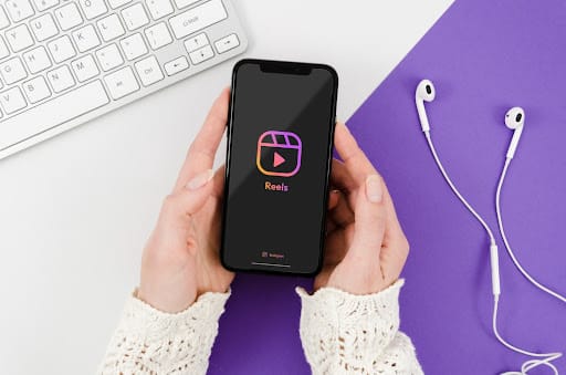 Smartphone displaying social media content representing scheduling posts on social media for orthodontic practices