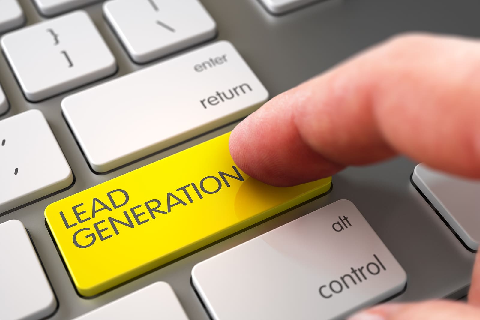 Finger pressing lead generation key on keyboard representing lead generation automation for orthodontists
