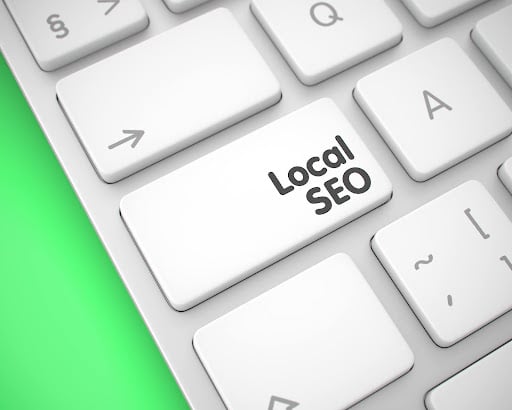 Keyboard with local seo key representing Google Business Profile optimization for local seo strategies